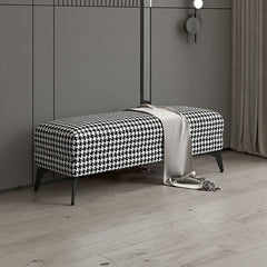 Versatile black footstool used as extra seating