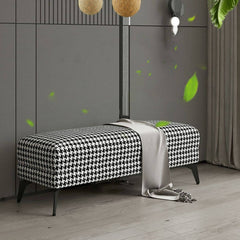 Versatile black footstool used as extra seating