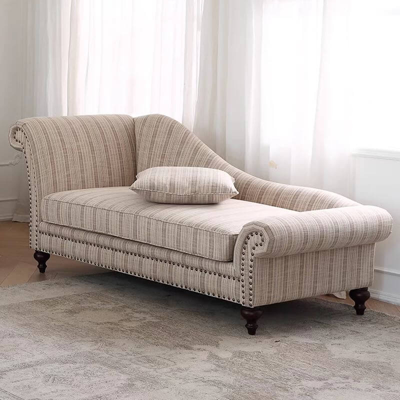 Casual chaise lounge accent chair with rolled arm in yellow-and-white striped pattern.
