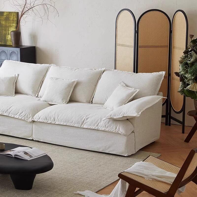Comfortable linen upholstered sofa with pillows