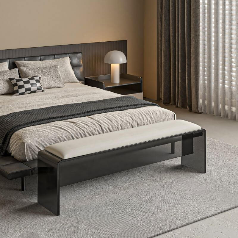 Grey upholstered accent bench in cozy corner