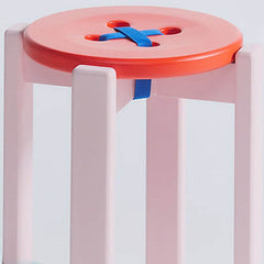 Chic red accent stool with minimalist design