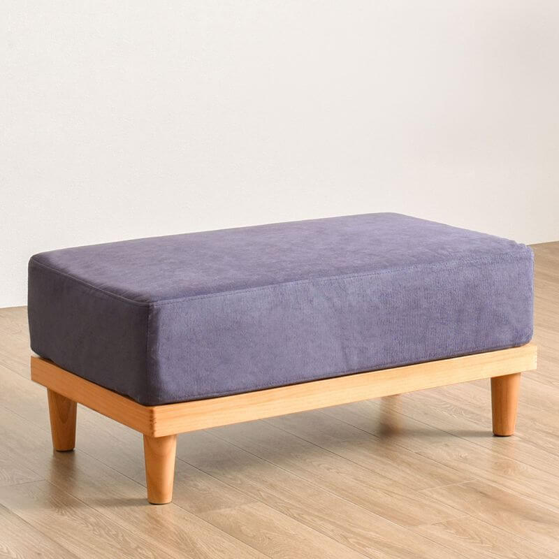 Azure colored footstool with removable cushion cover