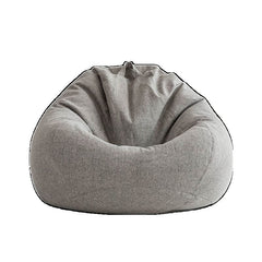 Person sitting on cerulean bean bag chair