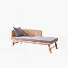 Overstuffed chaise lounge chair with natural finish