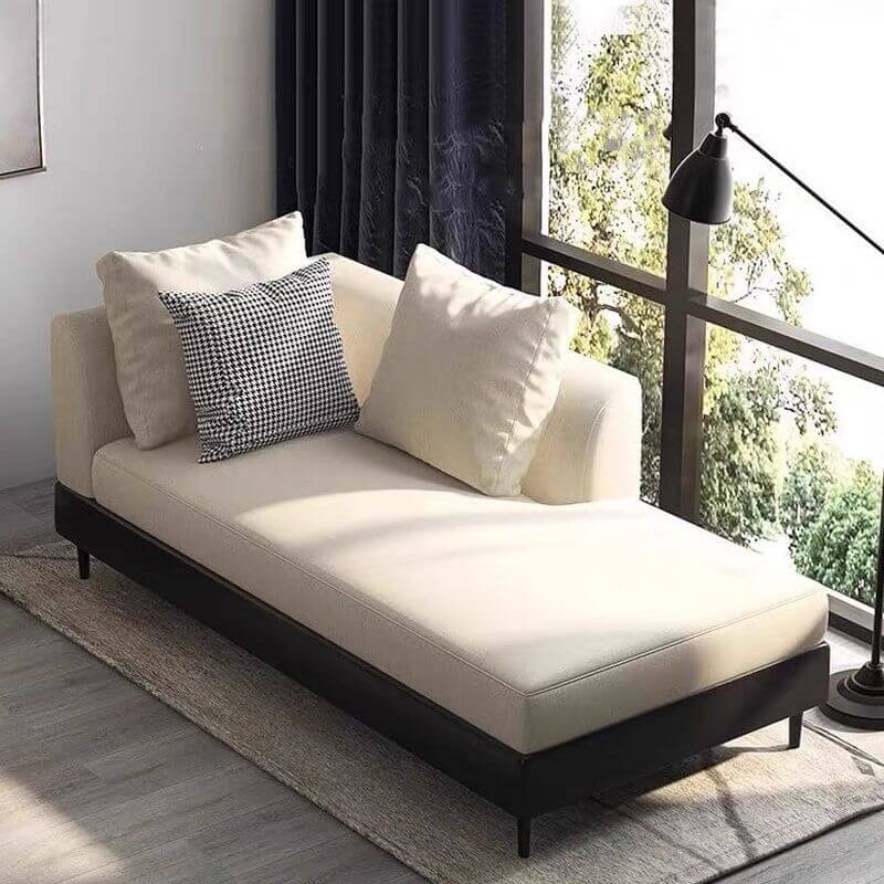 Modern chaise lounge chair with pillows