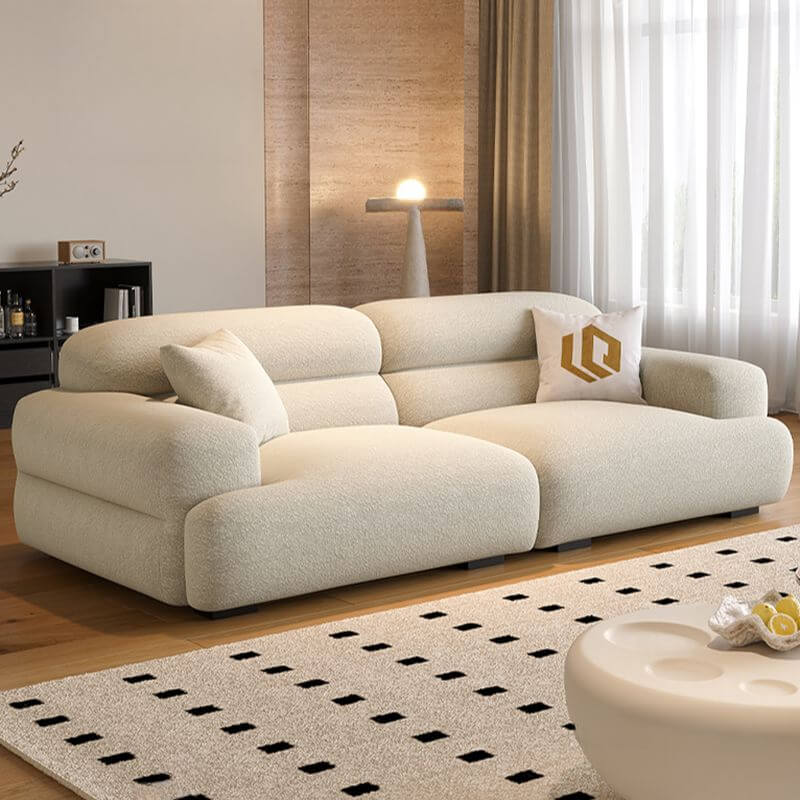 Chic off-white single sofa with biscuit back