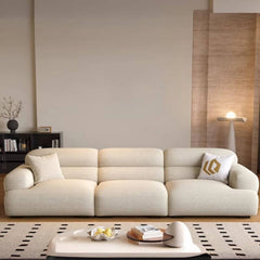 Comfortable off-white single sofa with cushions