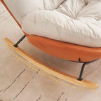 Upholstered rocking chair with wooden legs