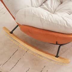 Upholstered rocking chair with wooden legs