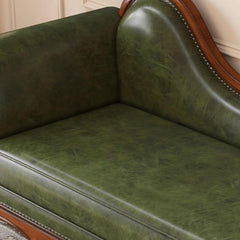 Traditional styled chaise chair upholstered in faux leather