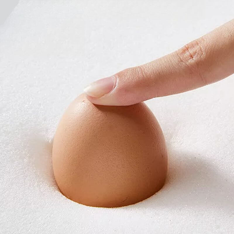 Close-up of the armrest on the Beige Chair