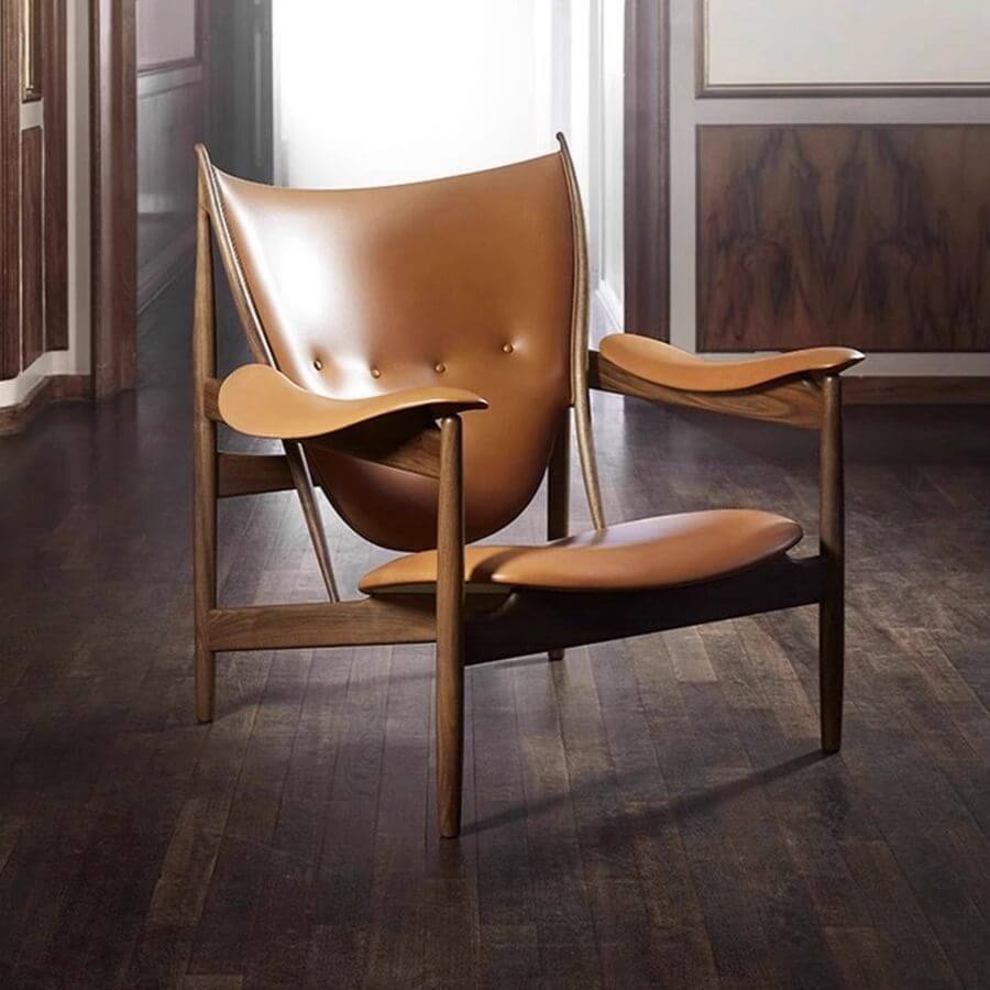 Living room with stylish black and orange accent chair