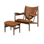 Contemporary black accent chair with tangerine accents