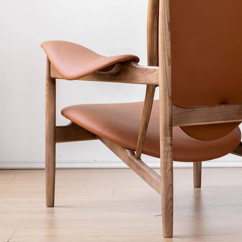 Cozy reading nook featuring black and tangerine chair