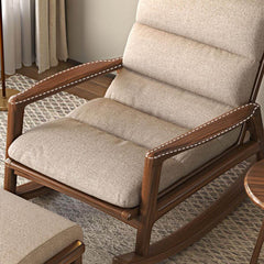 White upholstered rocking chair in a cozy corner