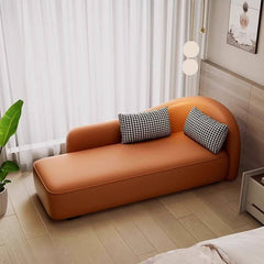 Contemporary master bedroom chaise lounge with solid color