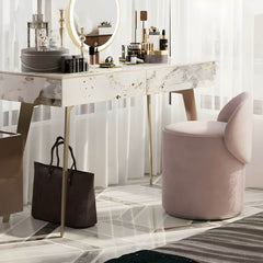 Swivel mechanism details of the pink vanity stool