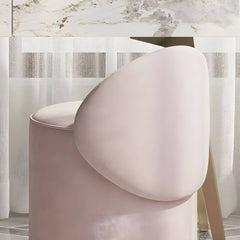 Pink vanity stool set against a stylish backdrop