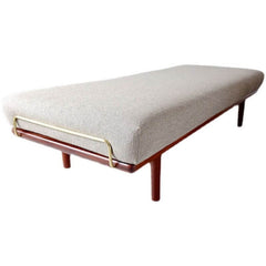 Elegant beige ottoman with solid color design