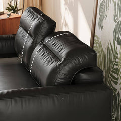 Midnight black contemporary sofa in cozy setting