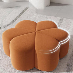 Orange cushioned ottoman for modern decor