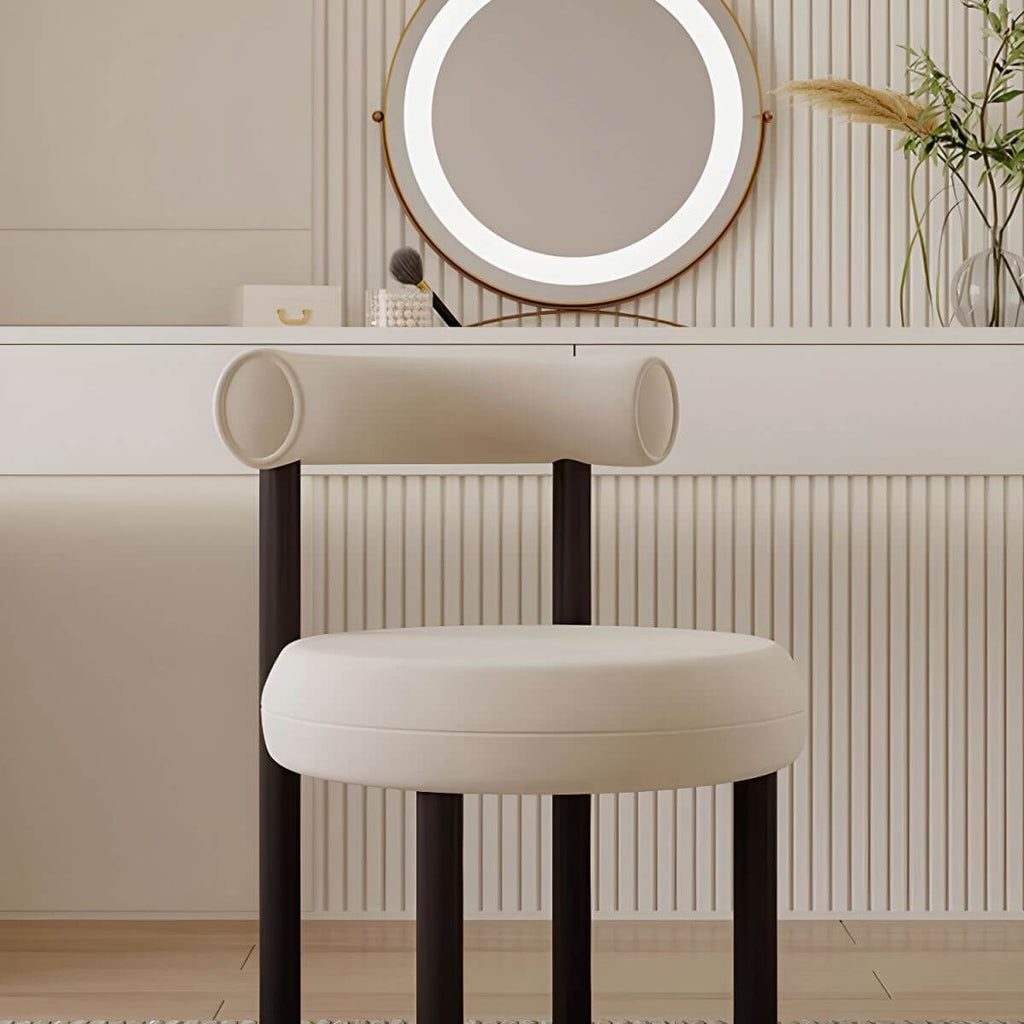 Chic metal framed vanity stool against a stylish backdrop