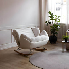 blue velvet rocking chair in living room