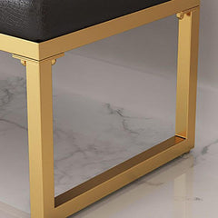 Modern gold legged ottoman in a living room