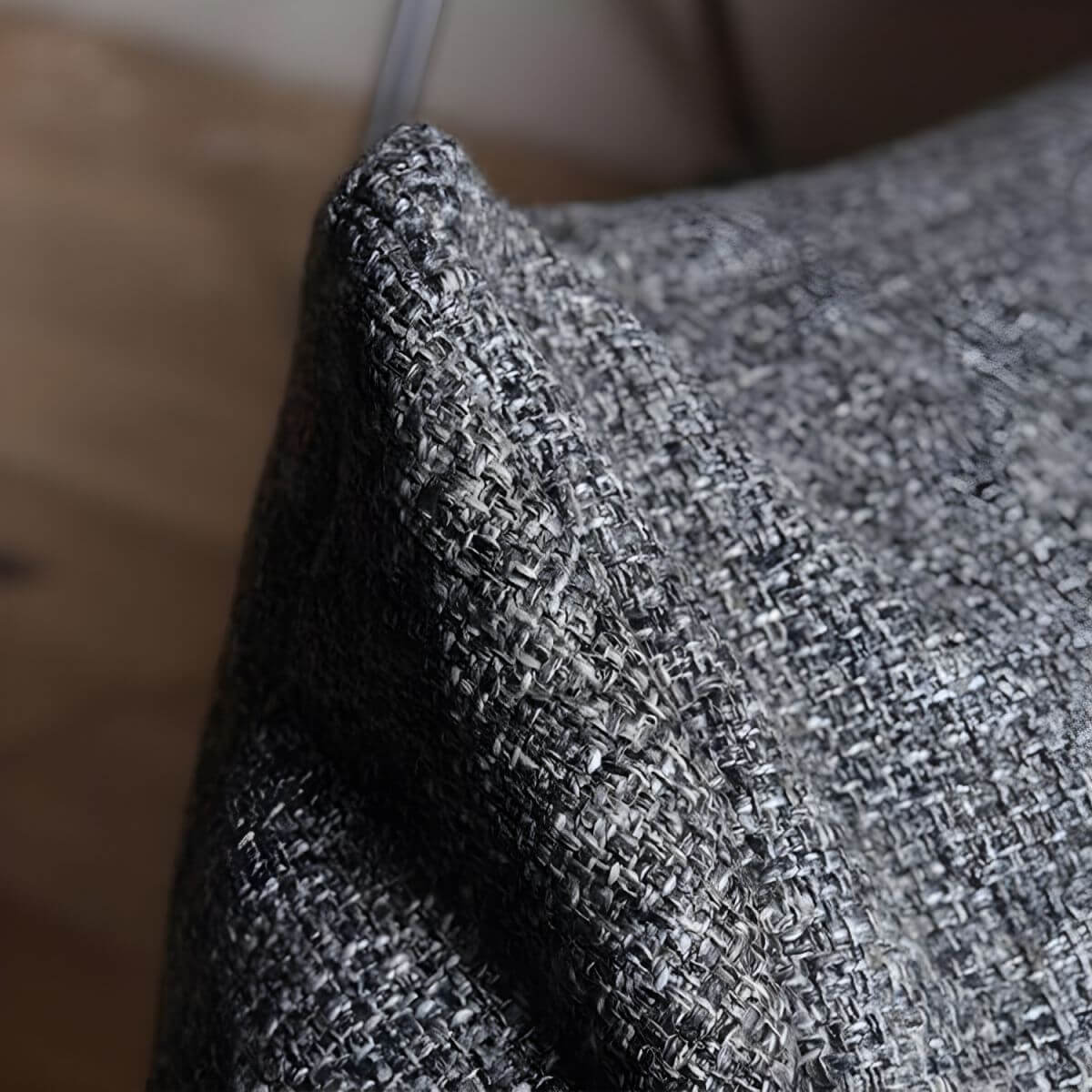 Bean bag chair surrounded by soft pillows