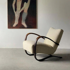 cream arm chair with wood armrests