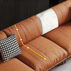 Grey and amber color sofa with pillows