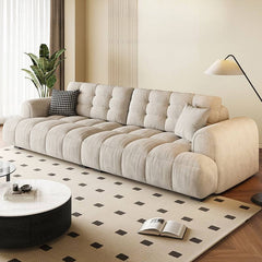 off-white modern sofa with biscuit back