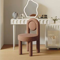 Elegant pink upholstered vanity stool with metal frame