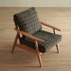 Natural wood parlor chair in stylish setting