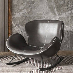 Stylish black winged-back chair in a cozy living room