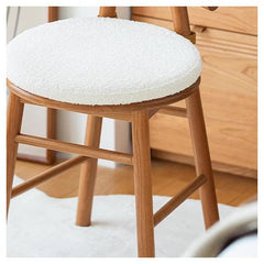 Upholstered stool in solid beige color