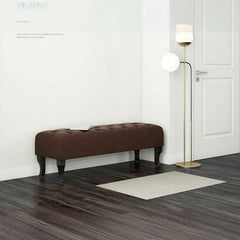 Black-legged ottoman in stylish interior