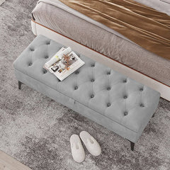 Metal legs supporting the rectangular ottoman