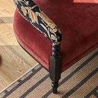 Armchair in natural light featuring floral motifs