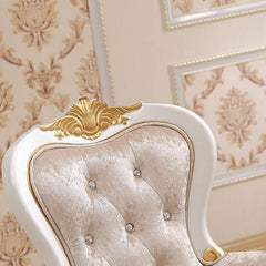 Close-up of tufted details on accent chair