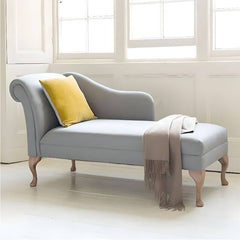 Grey upholstered chaise lounge in living room