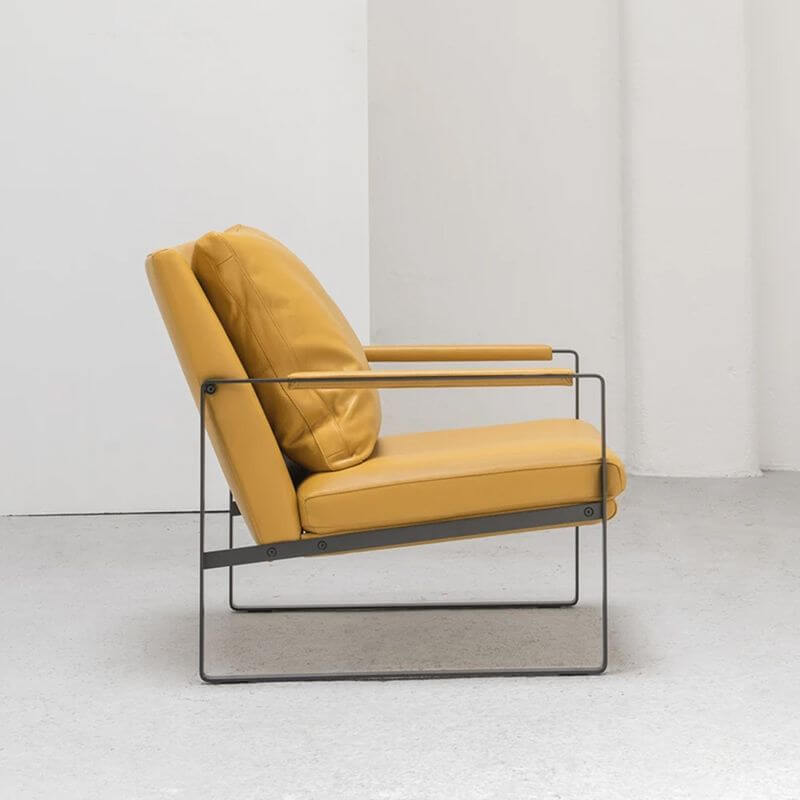 Close-up of faux leather material on armchair