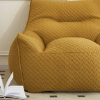 Maroon bean bag chair with plush fabric