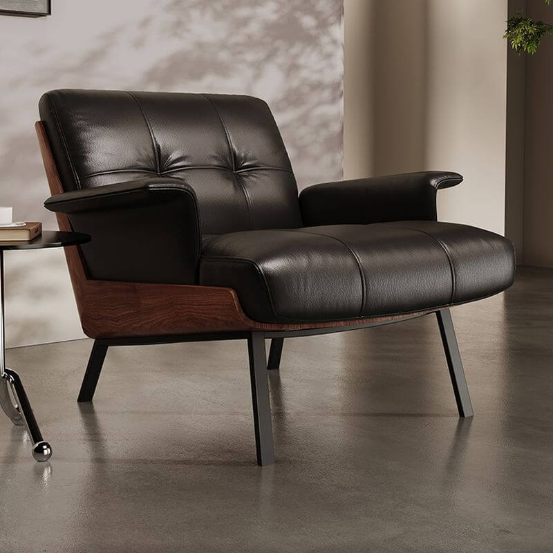 Ivory and black leather armchair in a living room setting