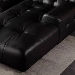 Elegant black sofa with tufted detail