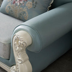 Detail of button-tufted upholstery on sofa