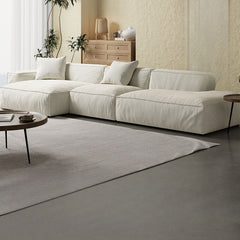 L-Shape White Upholstered Sofa Recliner in a modern living room