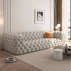 Light blue olive green off-white sofa couch from the side