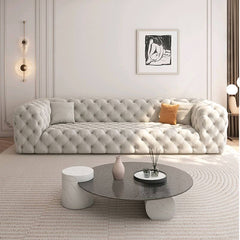 Modern sofa couch in light blue with three pillows